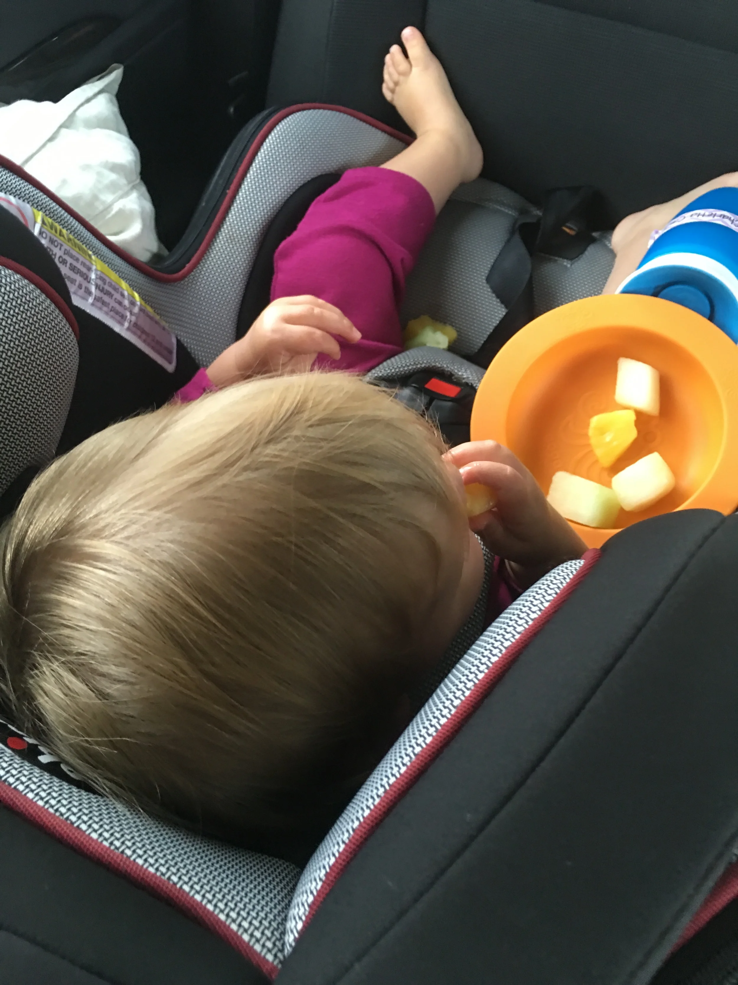 Our baby enjoying some fresh fruit on our 11 hour drive from Florid to Texas