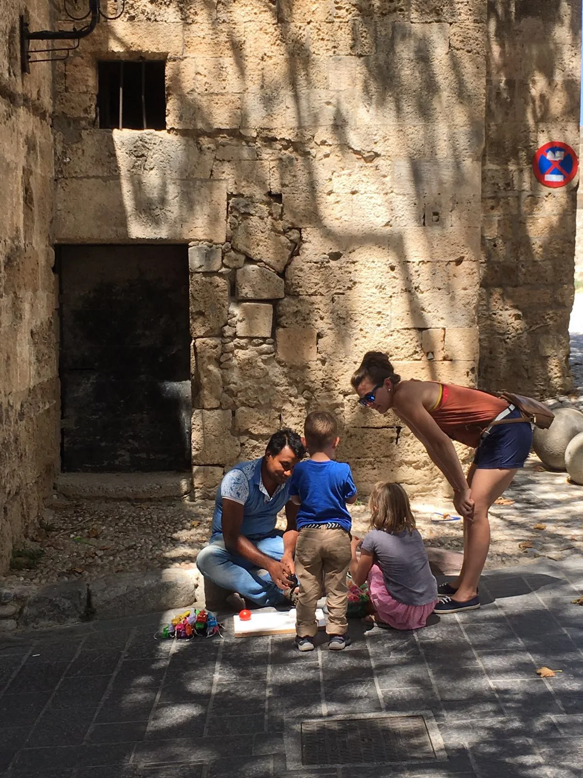 Jenny + The kids bartering in Greece