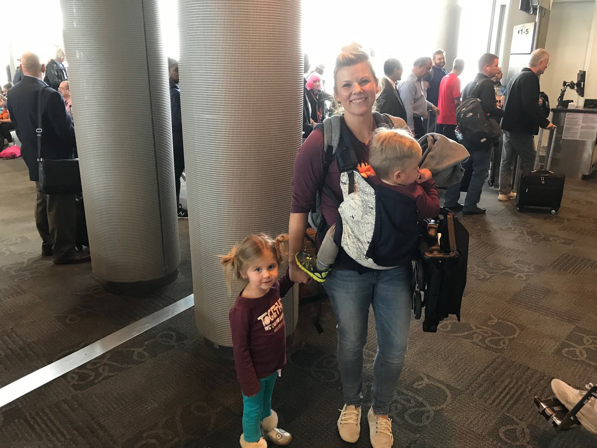 Backpack Diaper Bag + Stroller is all we used when I flew from Florida to Texas with the kids by myself