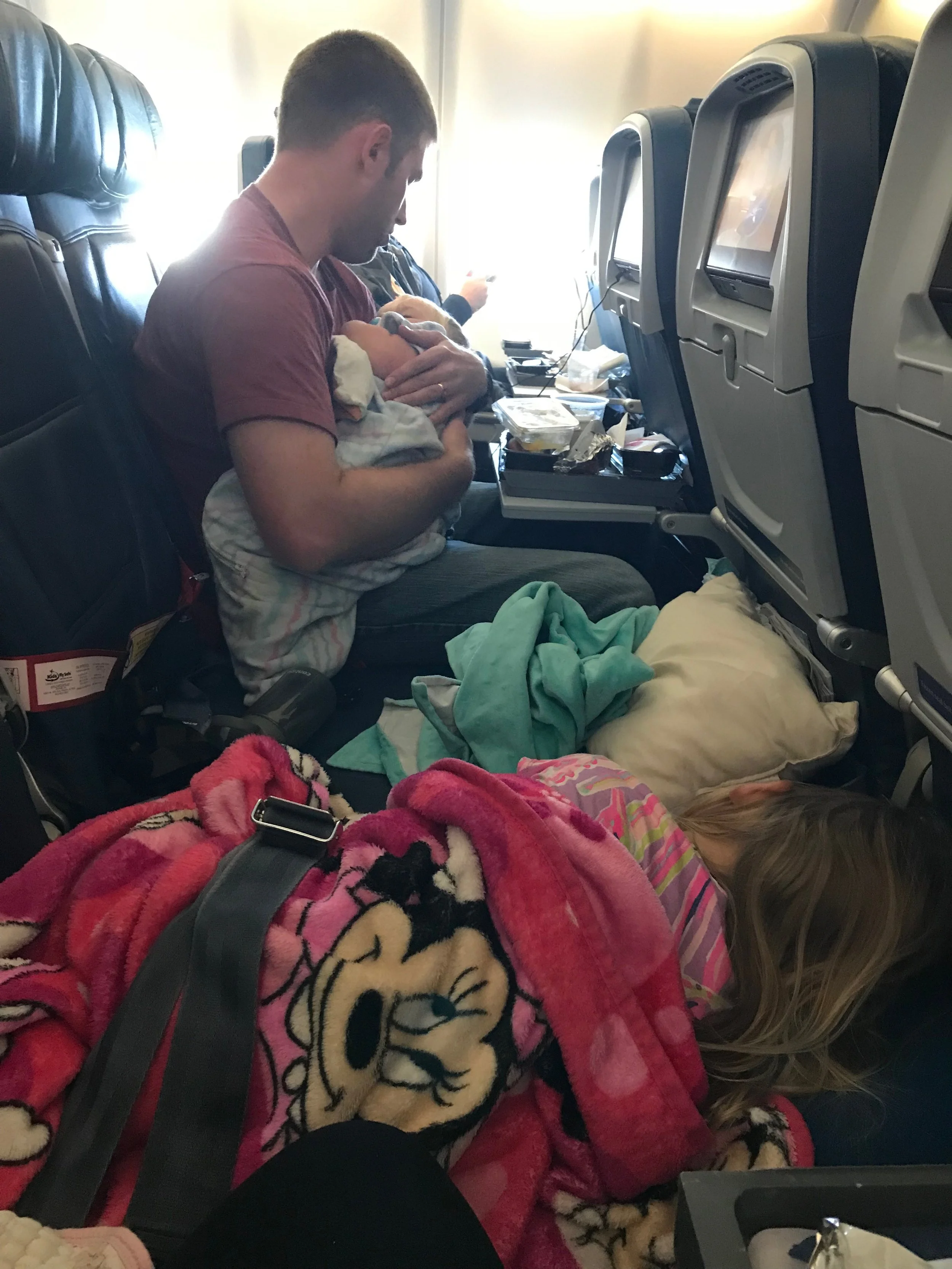 The baby still naps 1-2 times a day, so he napped twice on our Daytime flight from Paris to Atlanta -- our daughter "rested" for a while