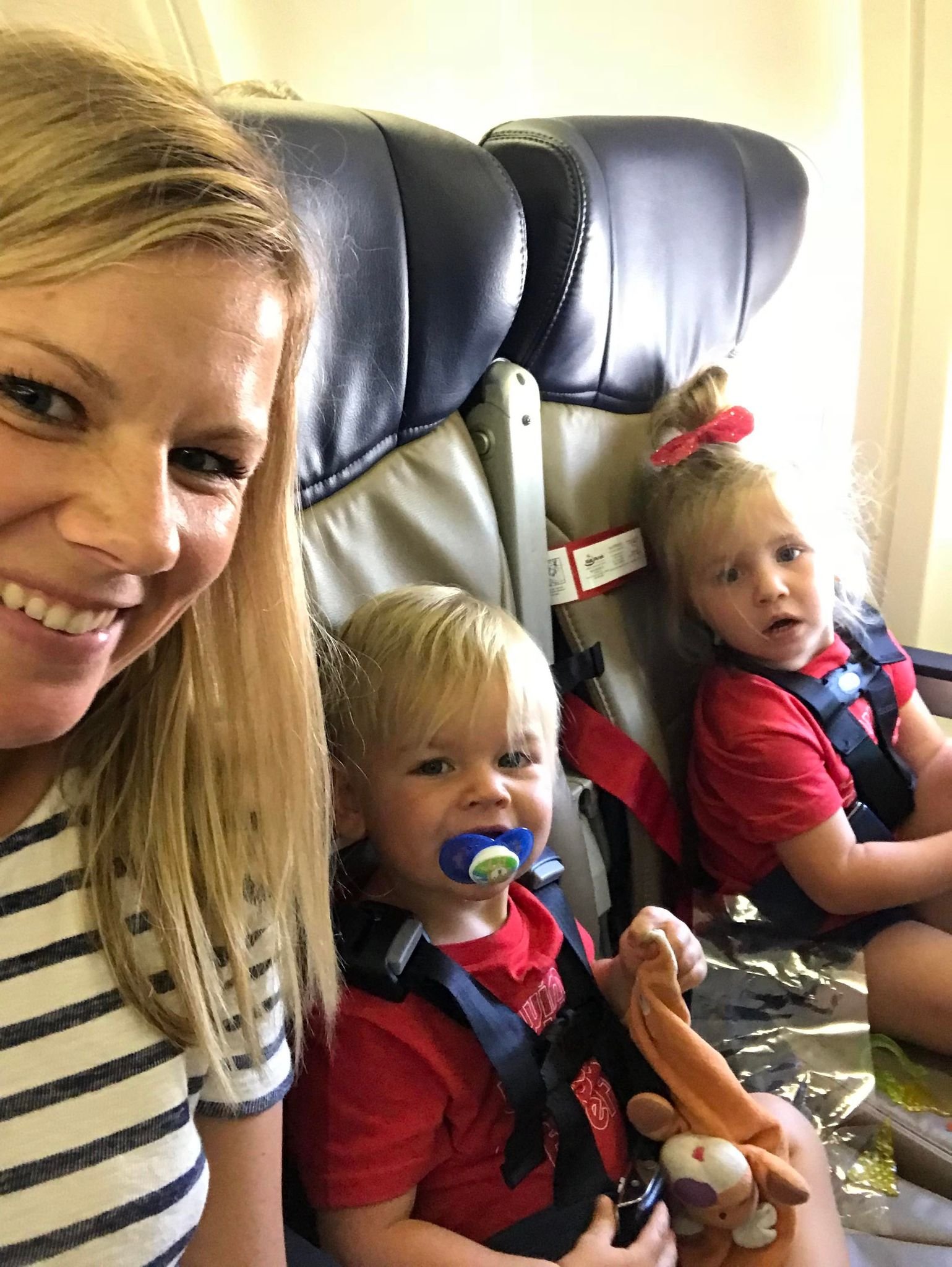 Airplane travel essentials with toddlers to keep them engaged and