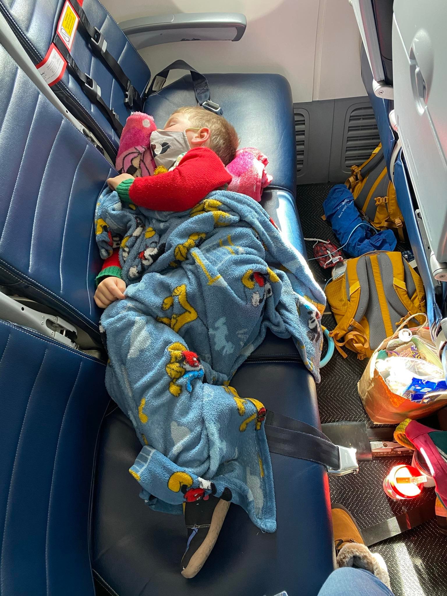 Tips for Overnight Flights with kids - Two Little Pandas