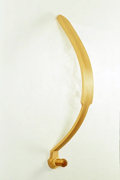 HANG UP 1999 BASSWOOD, CAST RUBBER 42” x 5” x 12”