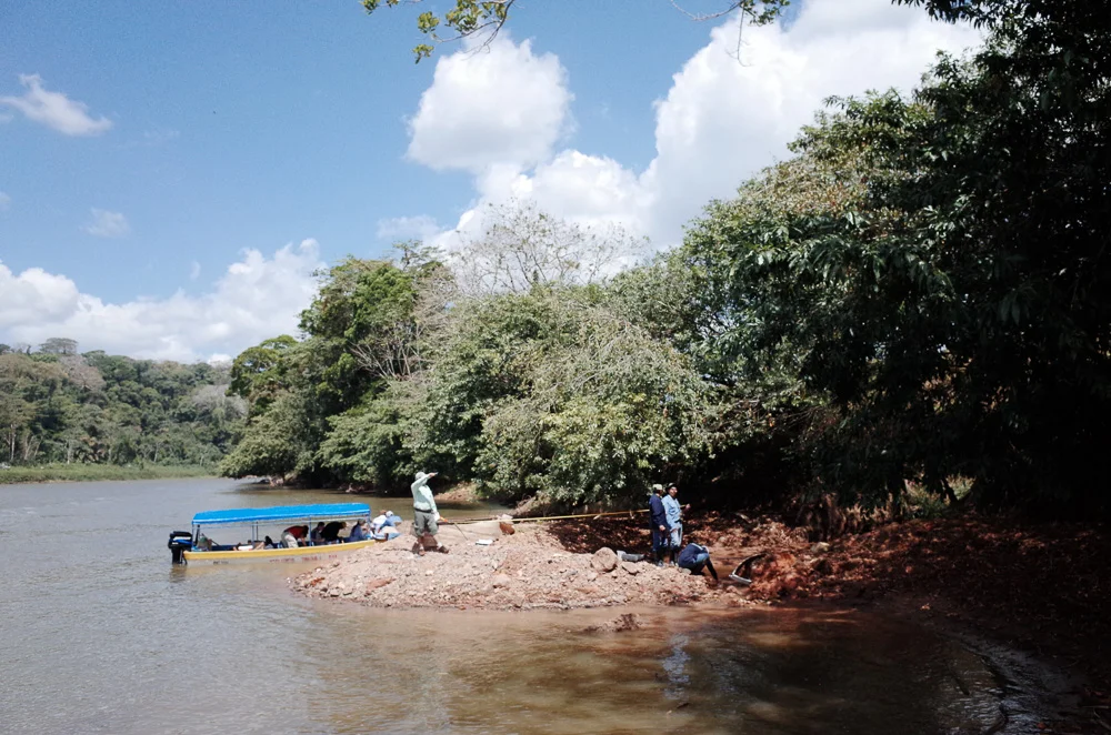 The field team estimates the volume of material delivered from a blown-out section of road.