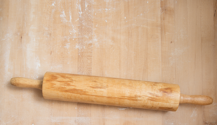 Grant Yegiazaryan of Su-Beoreg and Monta Factory rolling the dough that frames cheese and herbs for his wife Evelina’s beoreg, a family recipe. The rolling pin, described as irreplaceable, is an extension of his arms. “No other rolling pin will make this dough.” Photos by Ann Cutting.