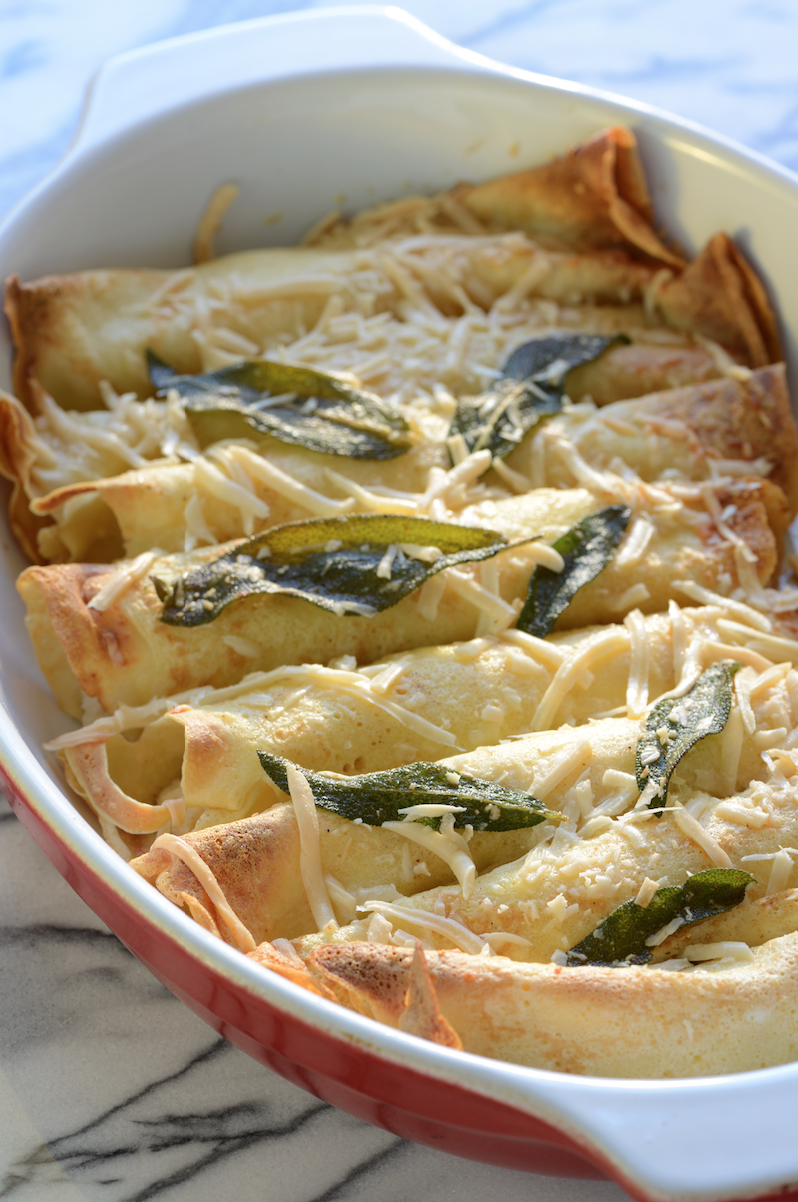 These crepes are filled with ricotta and melted butter flavored by sage leaves and topped with Parmesan. Heavenly! One of many ideas for filling. Photo by Ann Cutting