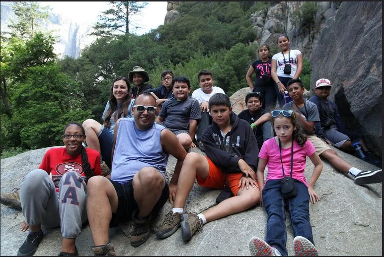 Students along with their mentors take a break from photographing to enjoy the scenery and pose for a picture of themselves