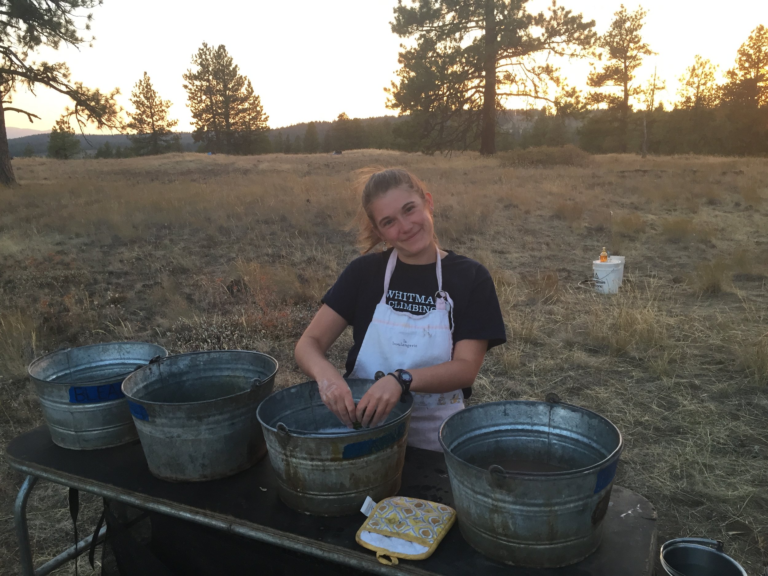 Maggie washing dishes on Starvation Ridge