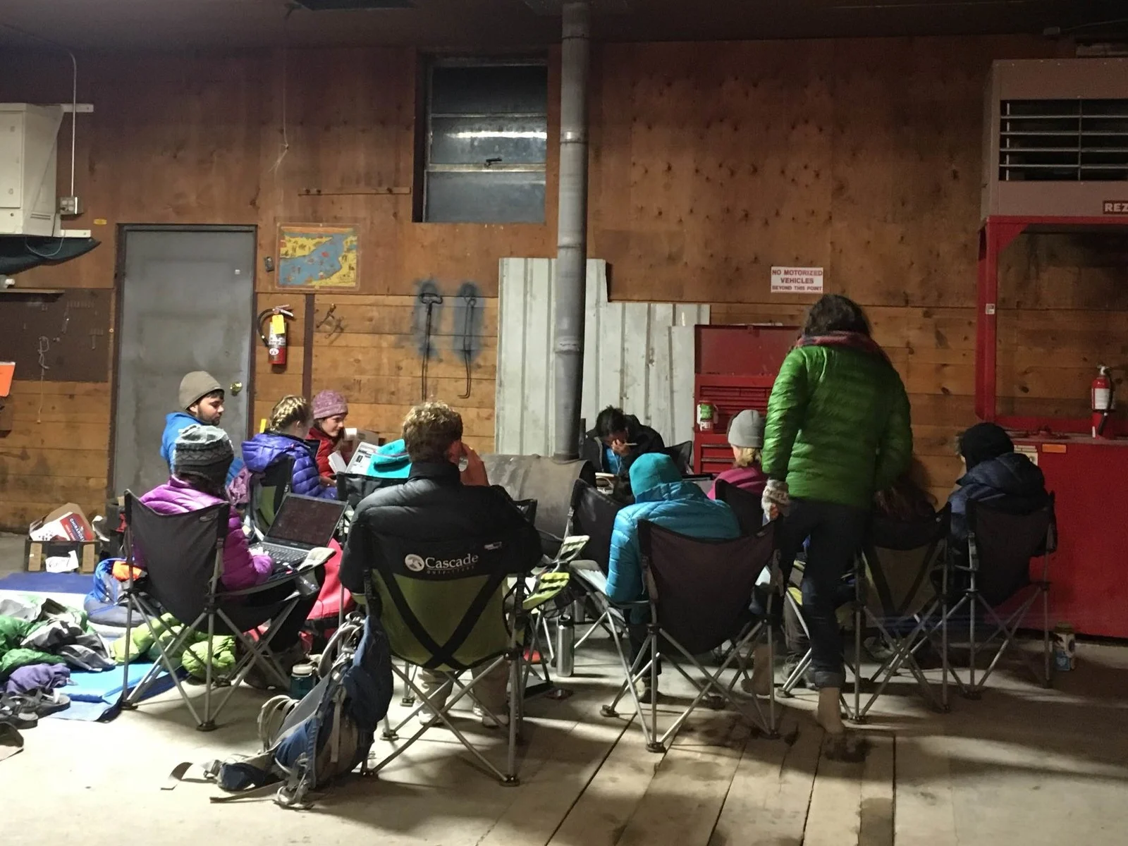Westies stay warm around the wood-fired furnace at the Flying D Ranch