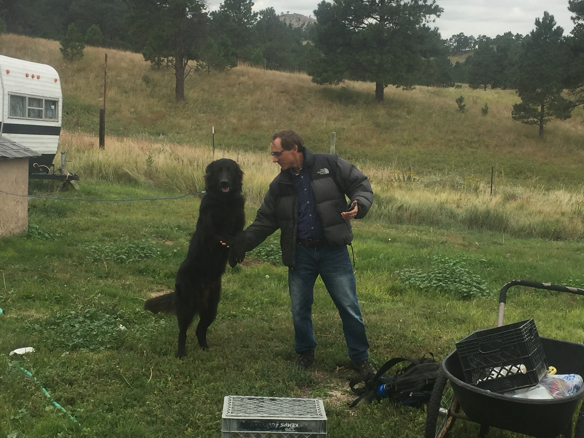 Todd Wilkinson, the author, shares a bow with Sapa, the dog