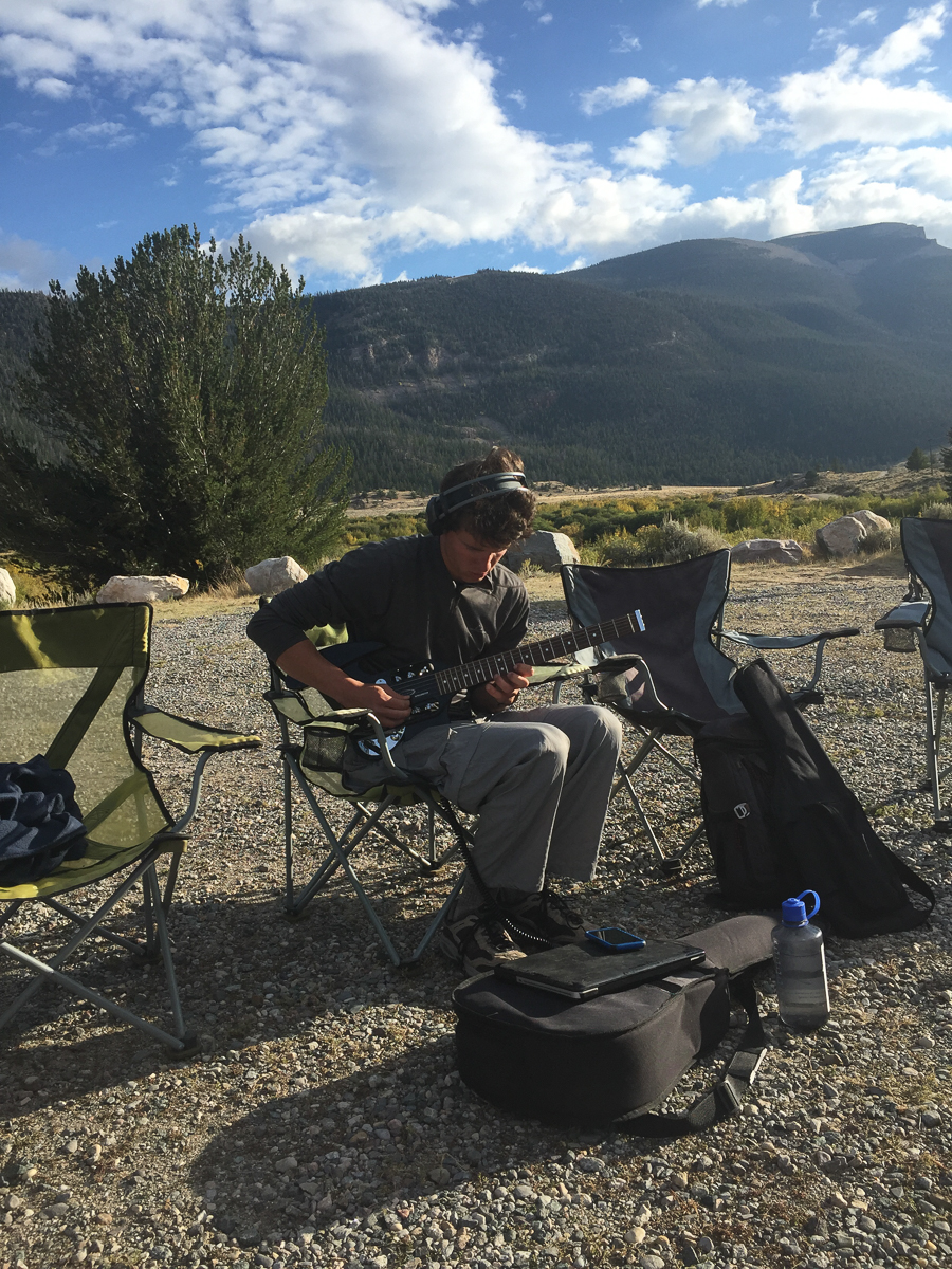 Hunter jams on the electric guitar outside Dubois, WY