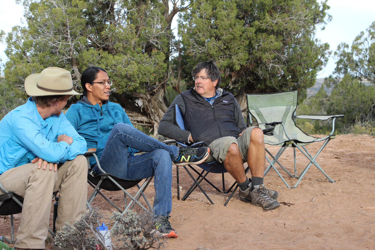 Phil and Collin talk with Adrian Horseherder in the chair circle