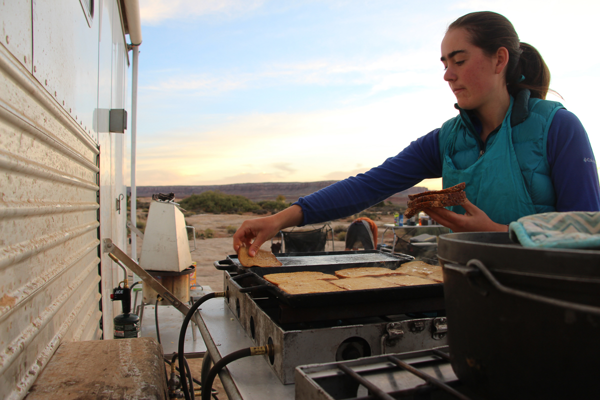 Sarah cooks up french toast on Comb Ridge