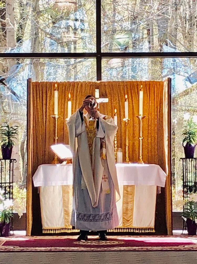 Fr.+Jon+-+Host+Elevation.jpg