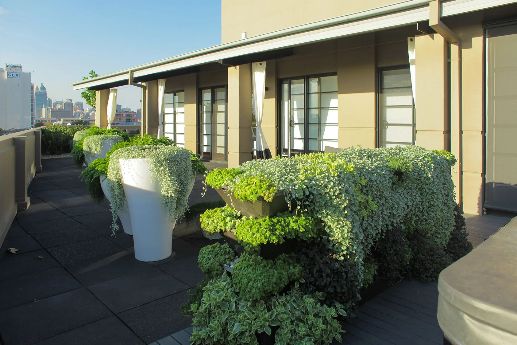 These pots are a great touch to this outdoor space. Very little maintenance when built correct.