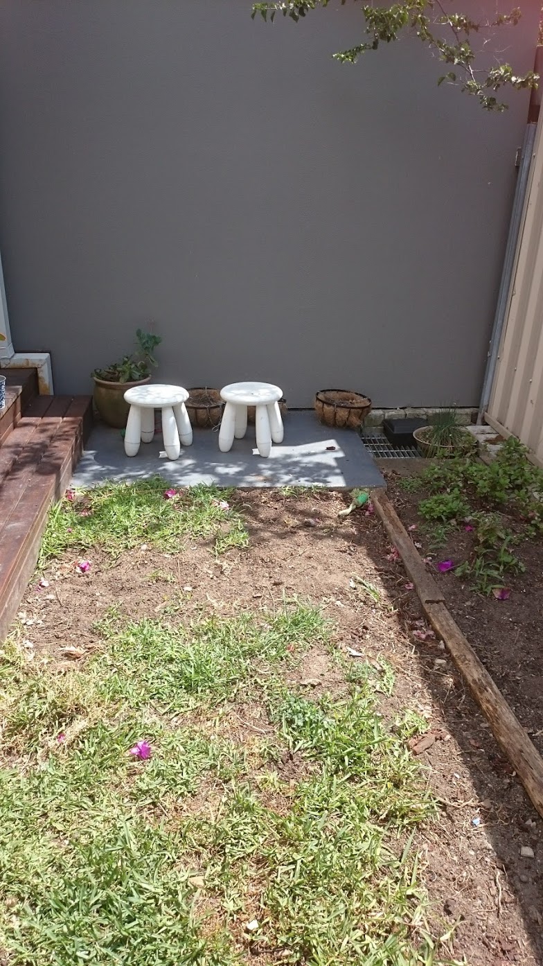 This rental property lost it's outdoor space due to a family dog and shade. The grass looking like this, makes it harder to rent. Synthetic grass was the answer.