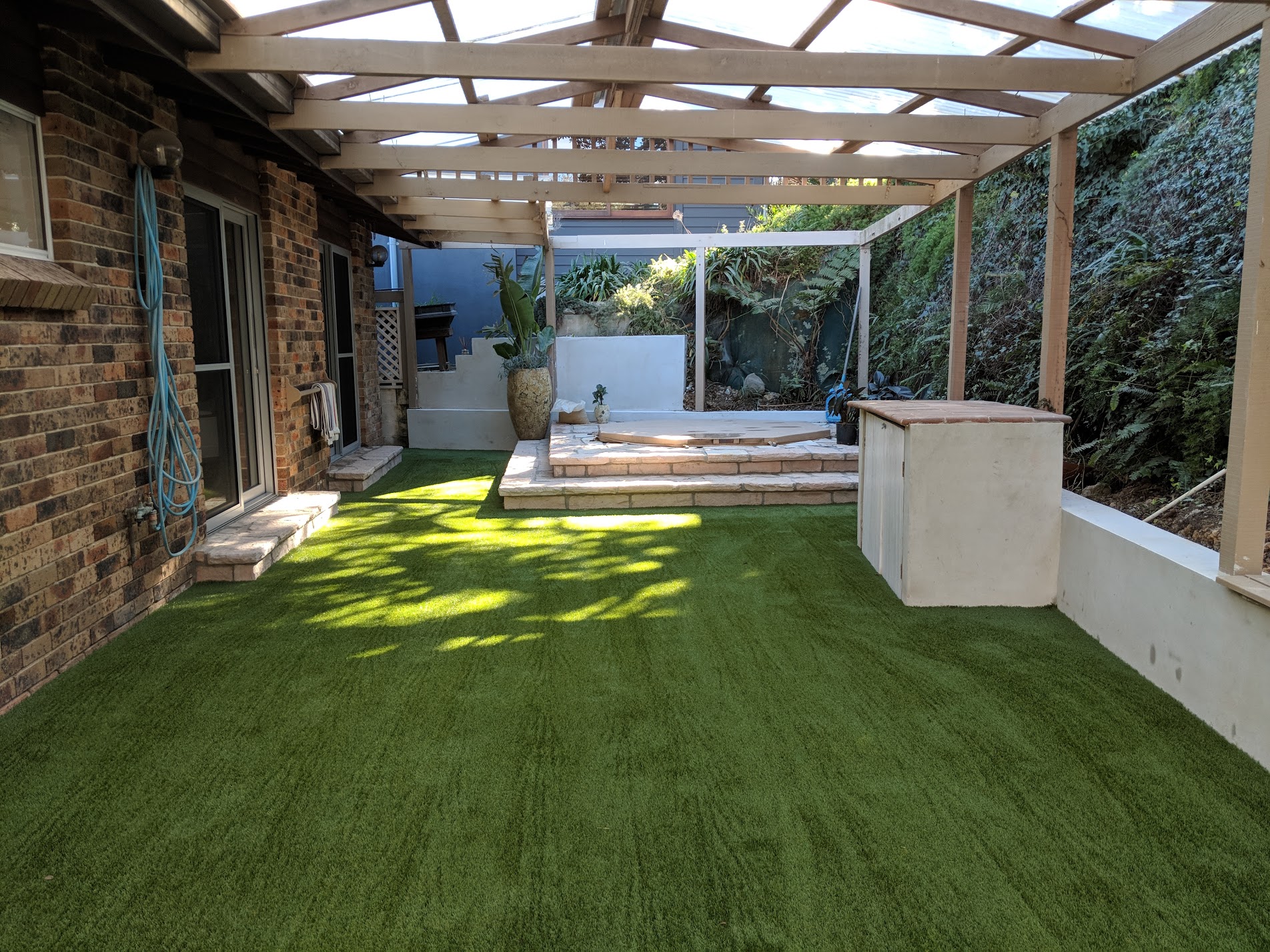 Royal Grass Silk 25 made a soft space to crawl or walk on from a hard paved area.