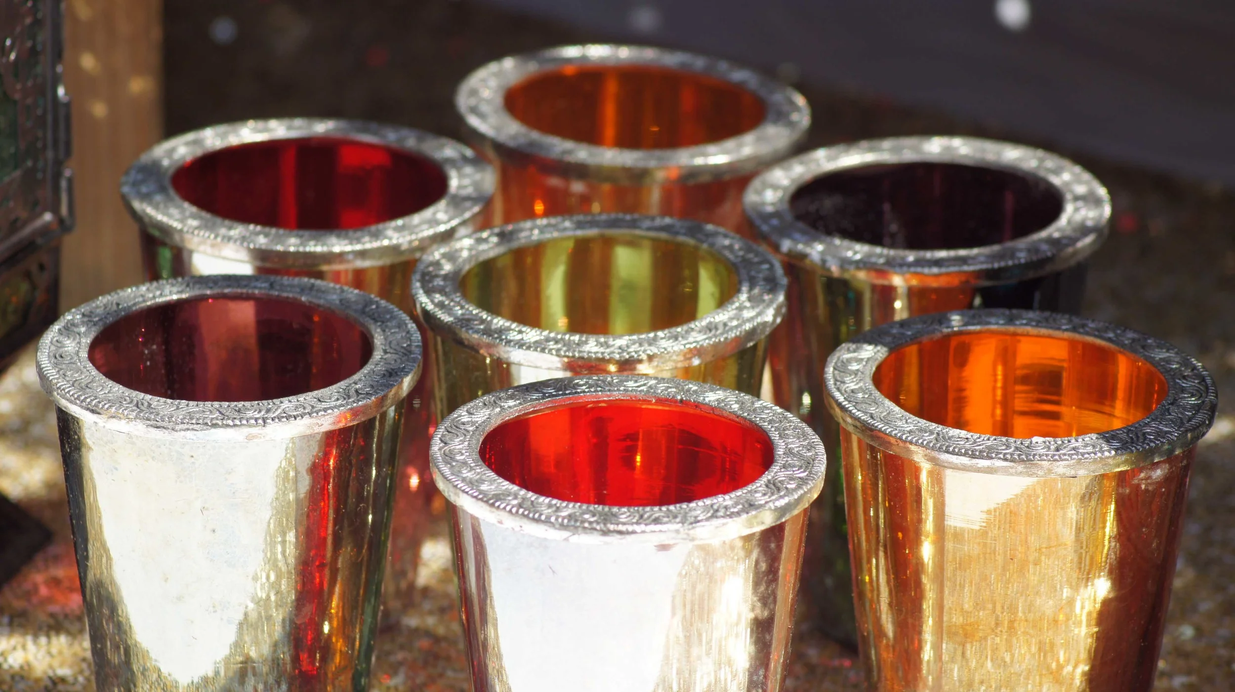 COLOURED GLASS VOTIVES £1