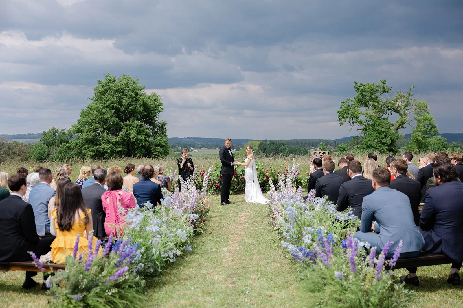 Meadow ceremony on the hill overlooking the Dordogne valley at destination wedding venue near St Emilion