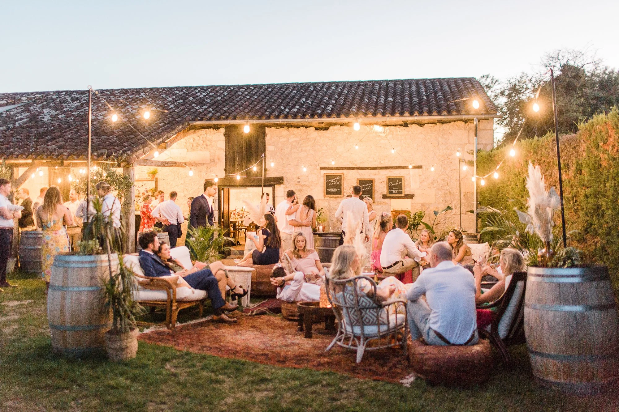 Boho evening bar scene at immersive multi day wedding venue, Chateau Rigaud in the Bordeaux vines