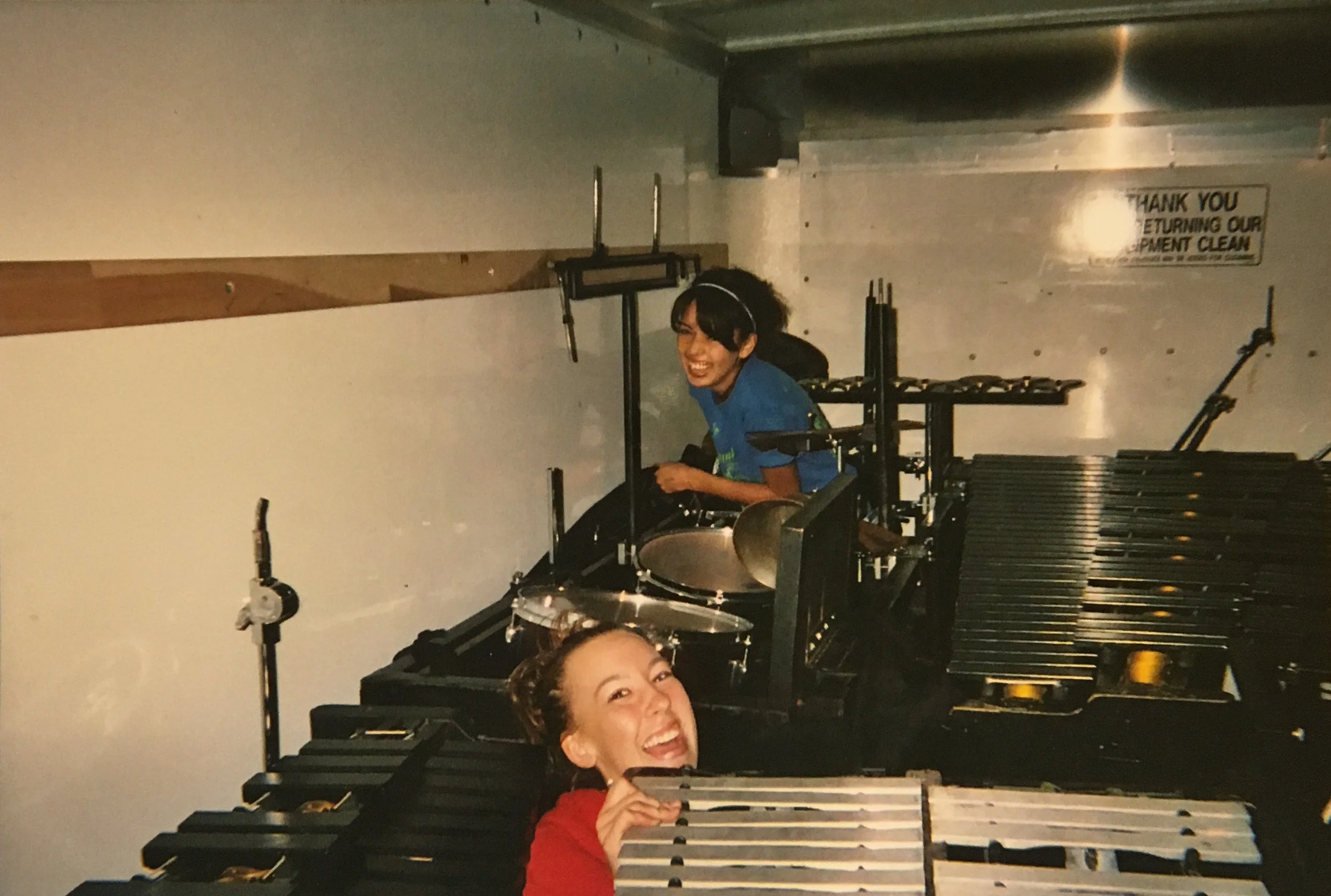 One of my longest friends, Emily, and I at a band competition. (We were sent onto the packed equipment truck to retrieve a flag we "needed" for the awards ceremony.... silly teenagers.) I met Emily in band in 2001, and earlier this year she was in my wedding!