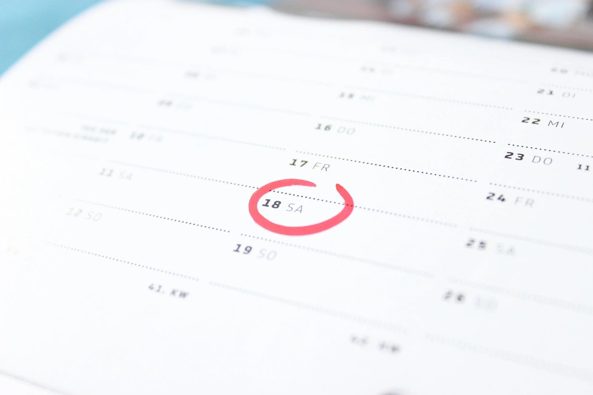 Red ink circles a date on a calendar
