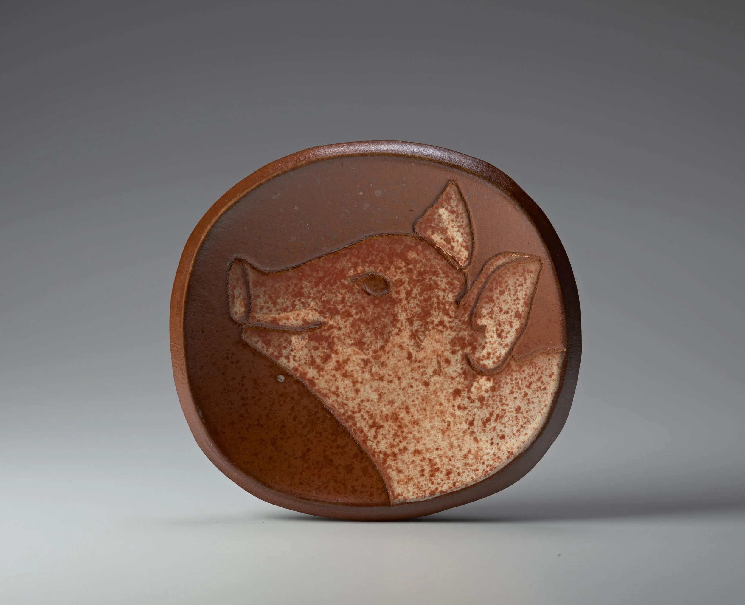 Mary Law, Happy Pig Plate, soda-fired stoneware, 6.5" x 7". Photo: M. Lee Fatherree