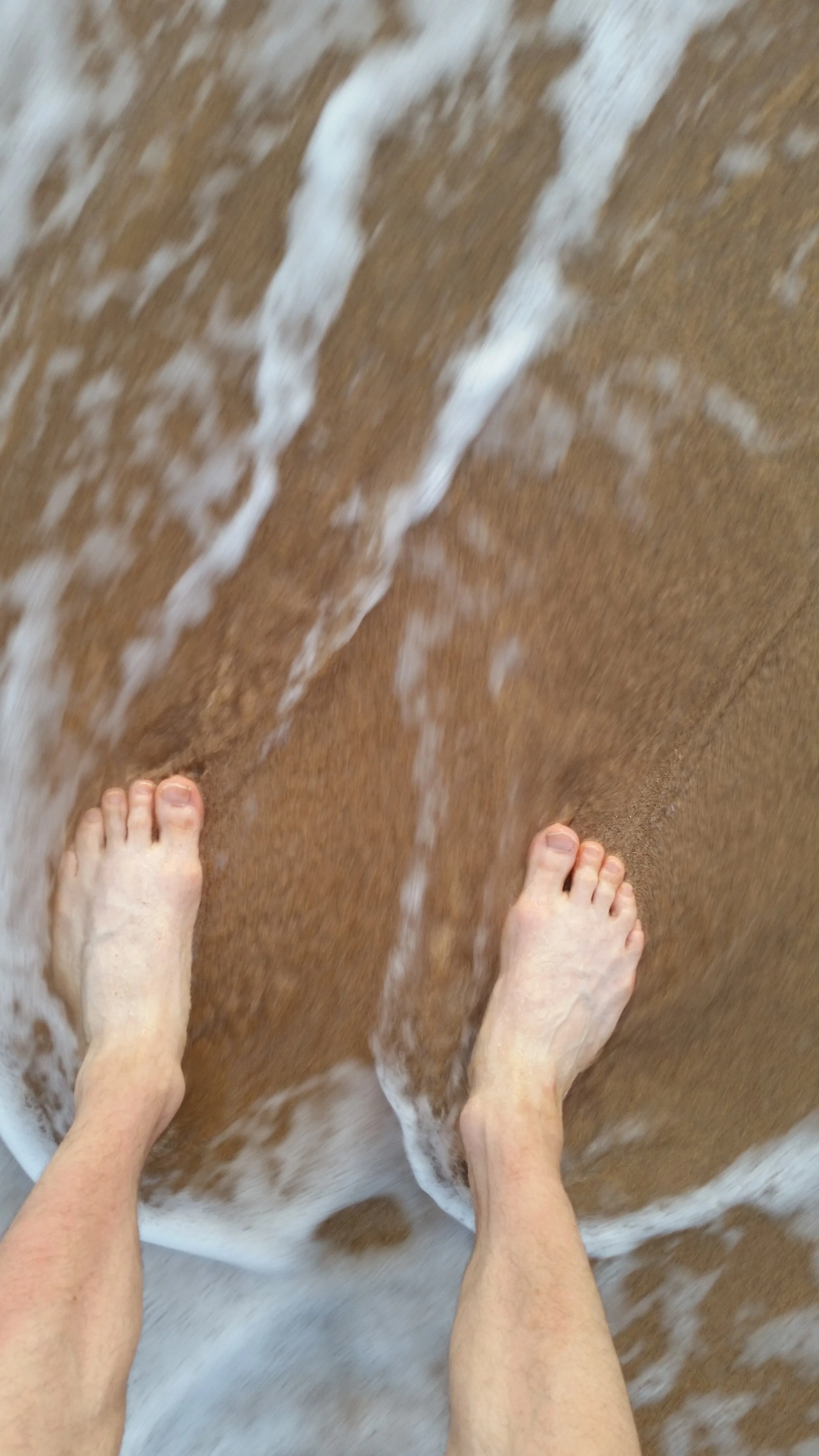 The author’s feet in the sands of Kaanapali Shores.