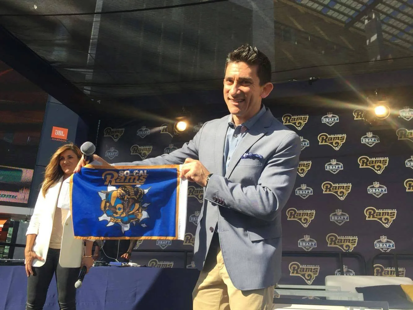 A ndrew Siciliano from the NFL Network, holding our So Cal Rams Booster Club Car Flag at the LA Rams Draft Party at LA Live. (2016)
