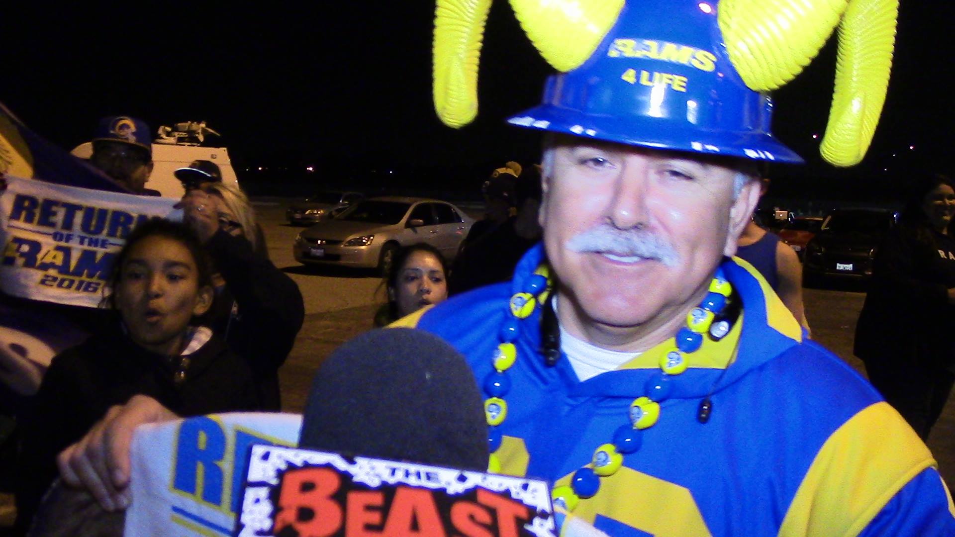 Staff Member Joe "Silver Fox" Ramirez being interviewed by the Beast 980AM, during the Rams return to Los Angeles celebration. (2016)