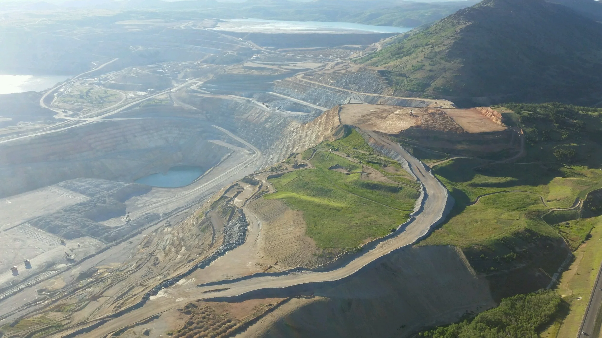 The Continental Pit fills with water with the Berkeley pit in the background.