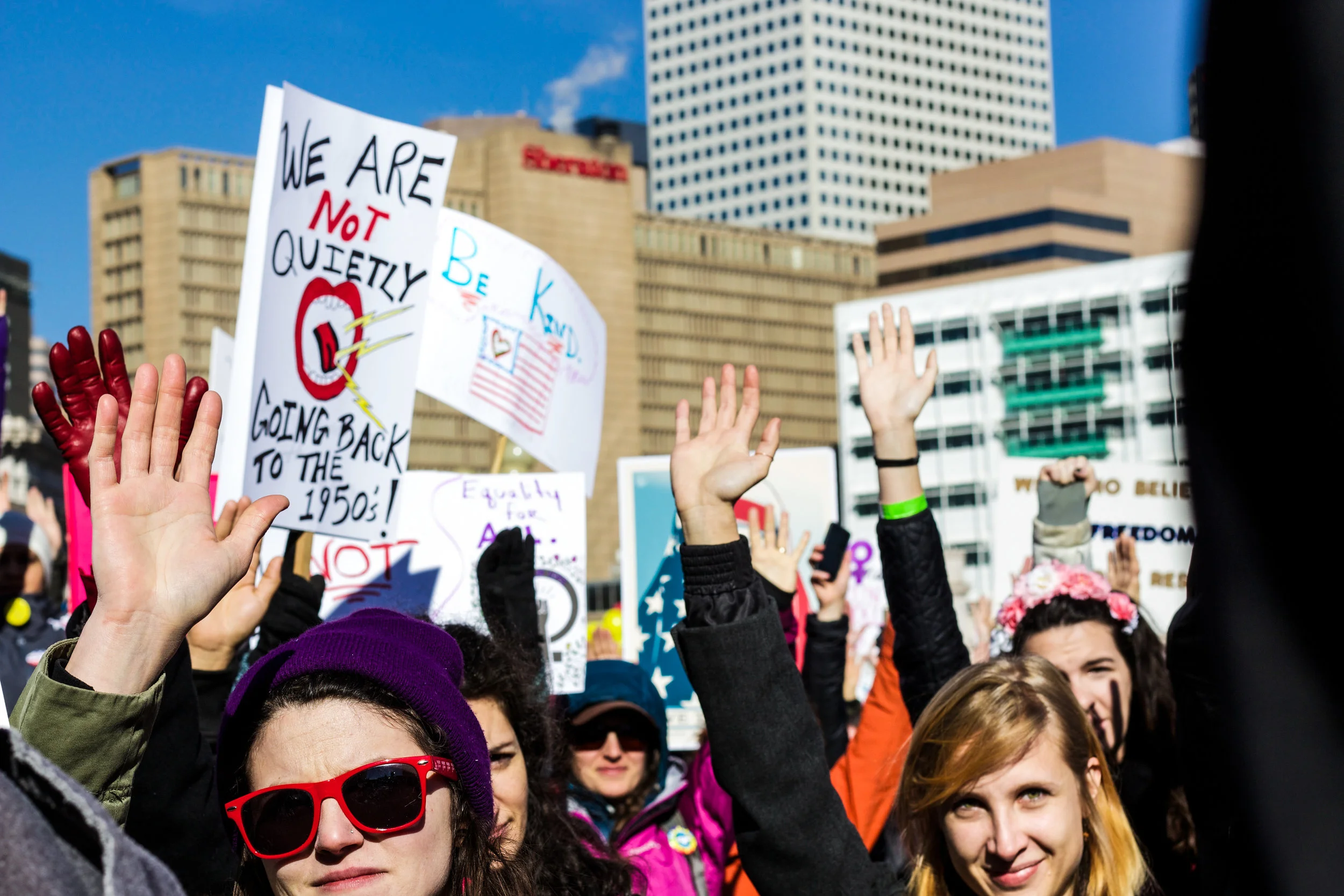  January 21st, 2017. Women's March protesters raise their hands if they are or know someone who has been a victim of sexual assault.&nbsp; 