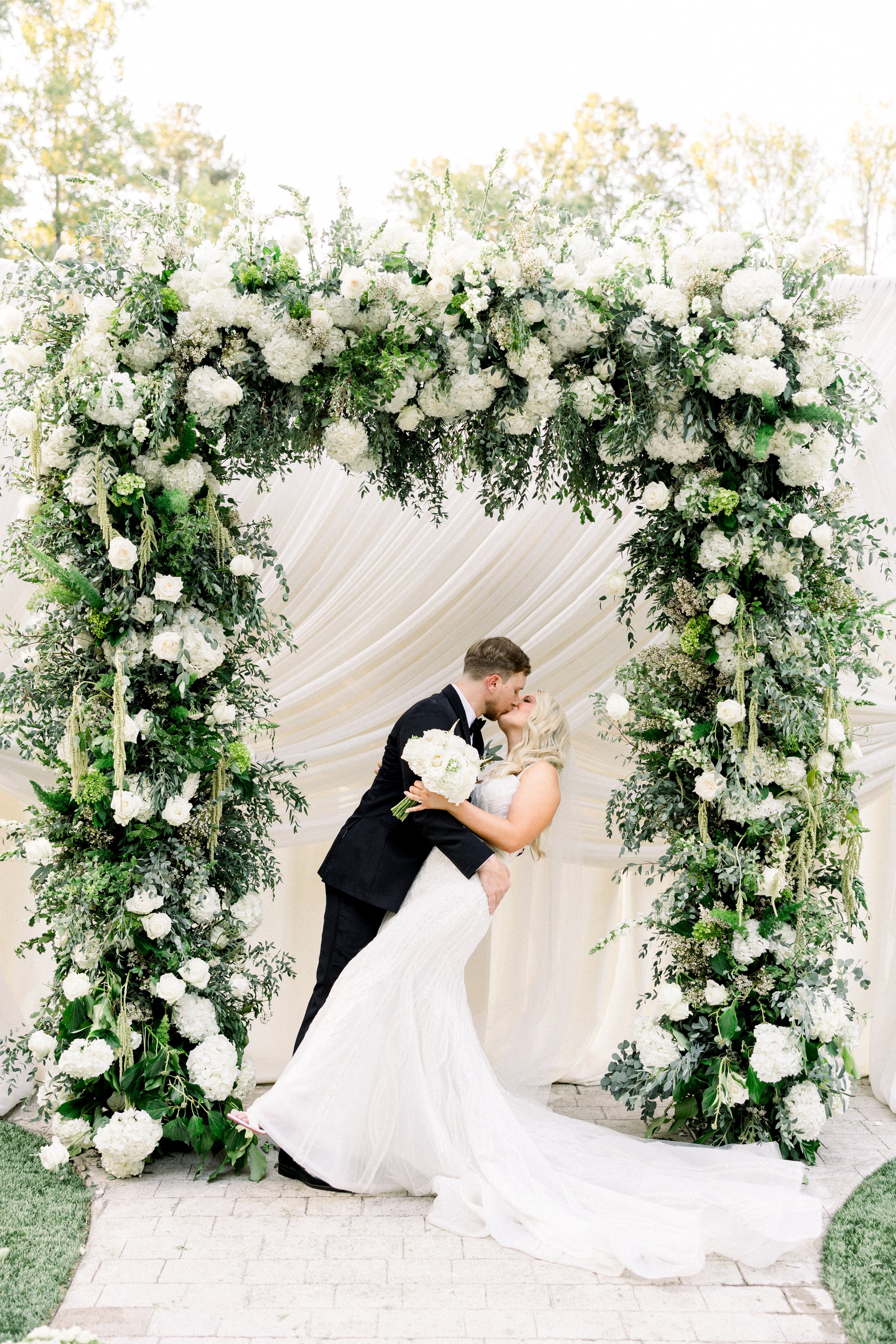 Wedding Ceremony White and Green Arbor.jpg