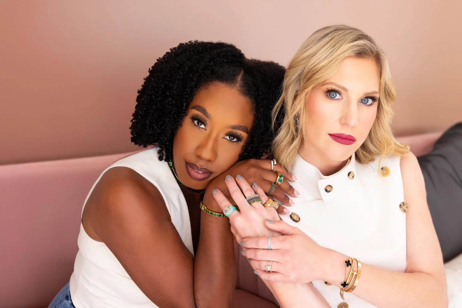 Premium personal branding photography by AMorgan Studios featuring two entrepreneurs in white