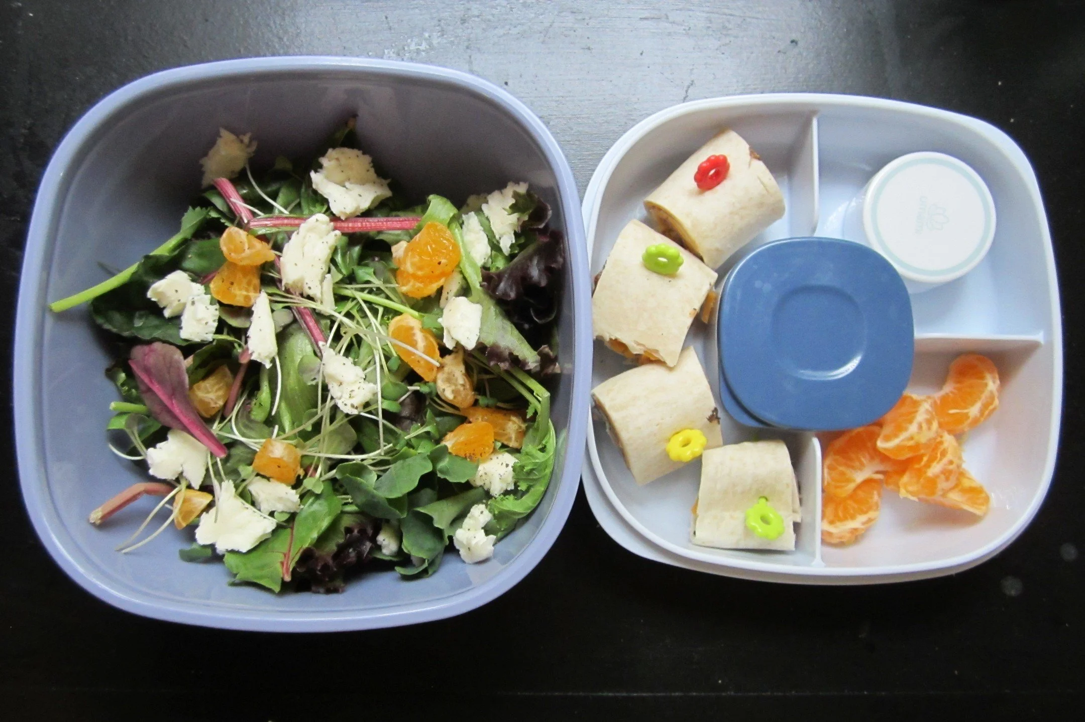 summer salad bento! 🥬☀️🍱 fresh greens with mozzarella, mandarins, and apple vinaigrette. served with a sliced almond topping, beef and cheese roll-ups, and more mandarins 🍊