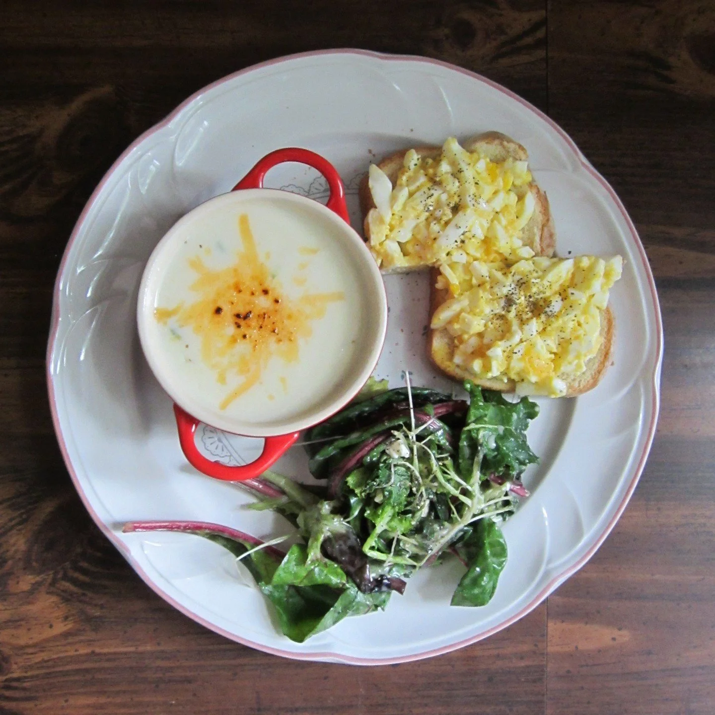 a quiet dinner alone 🍄✨ japanese egg salad sandwich, panera baked potato soup, and fresh greens with apple vinaigrette.