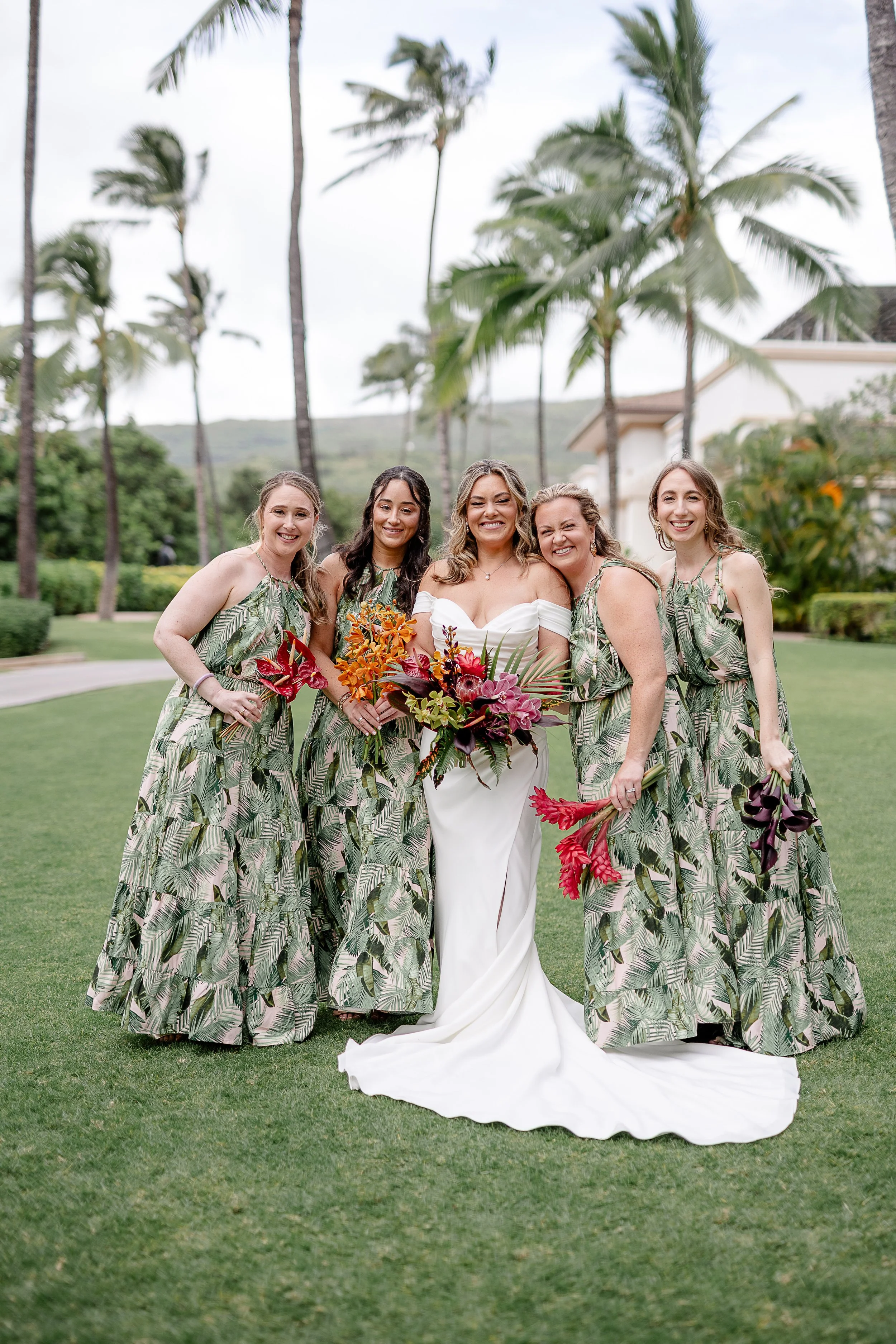 bride with bridesmaids in tropical green dresses in Hawai'i