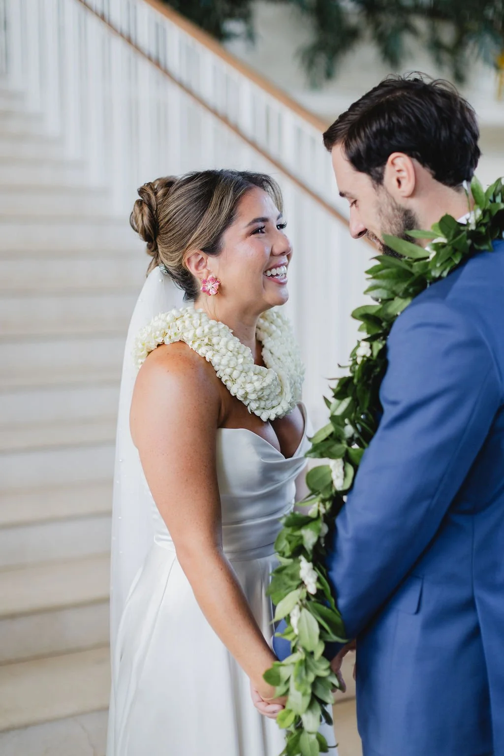 bride and groom with leis