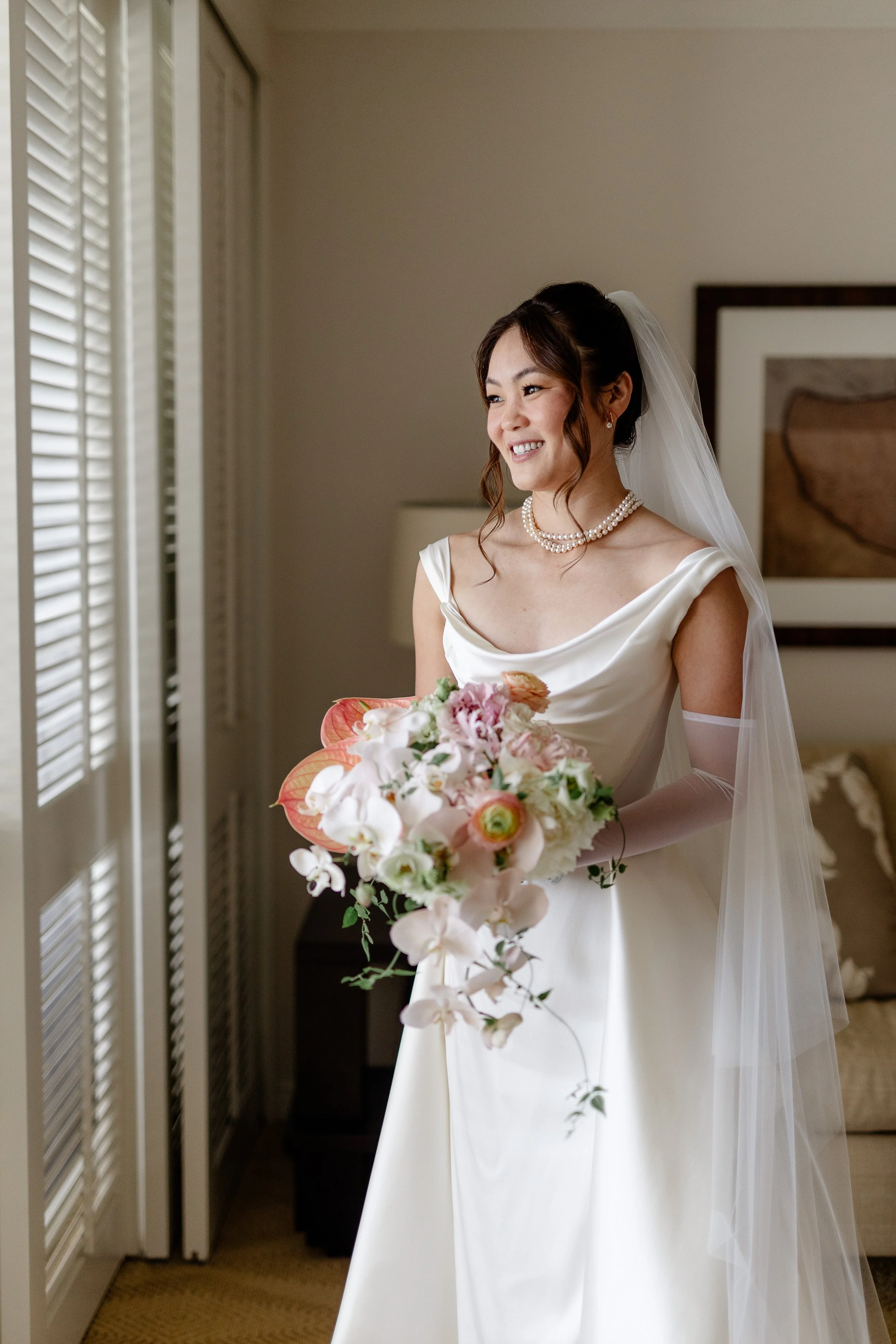 bride holding pastel bouquet