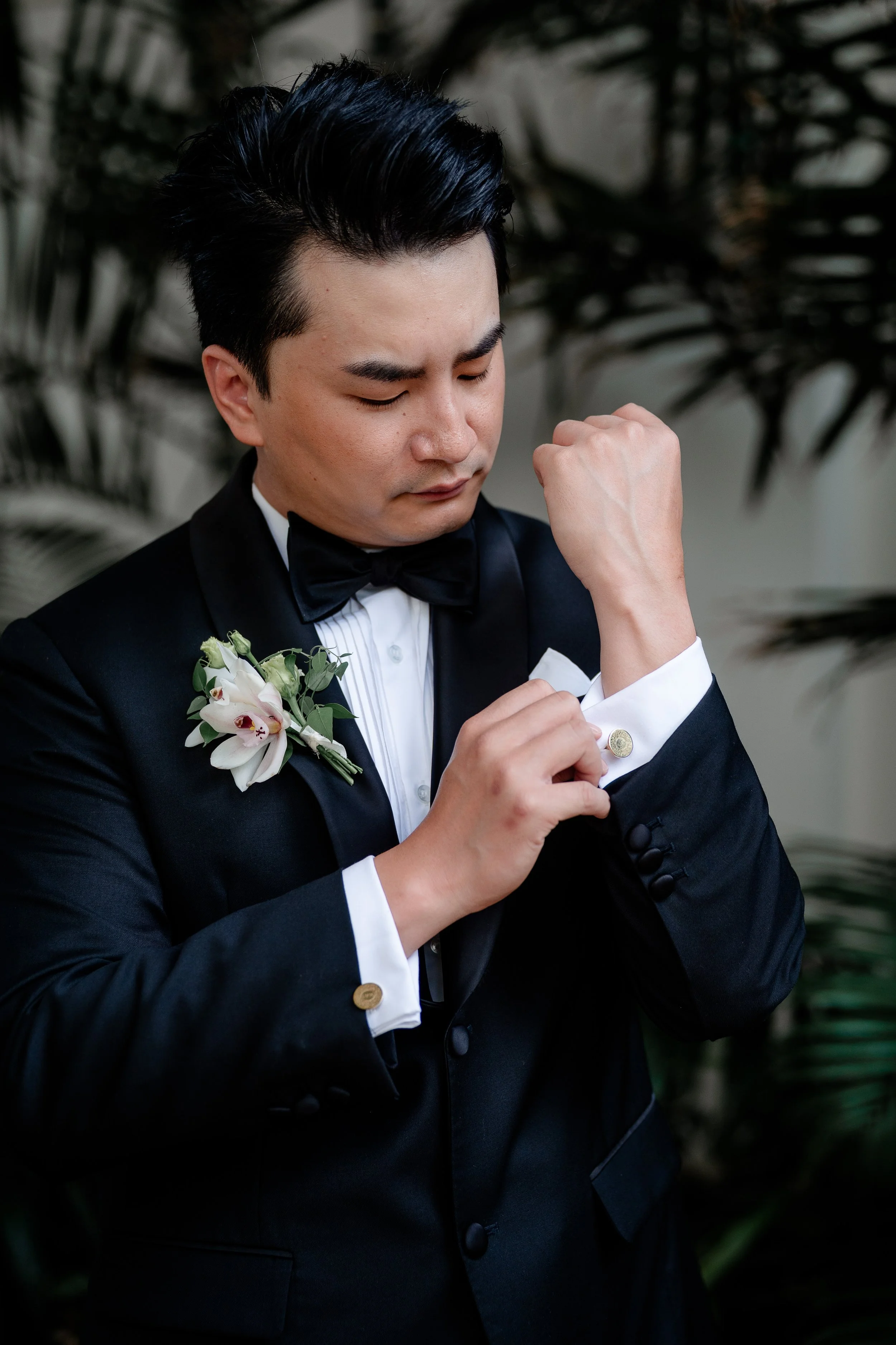 groom adjusting cufflinks