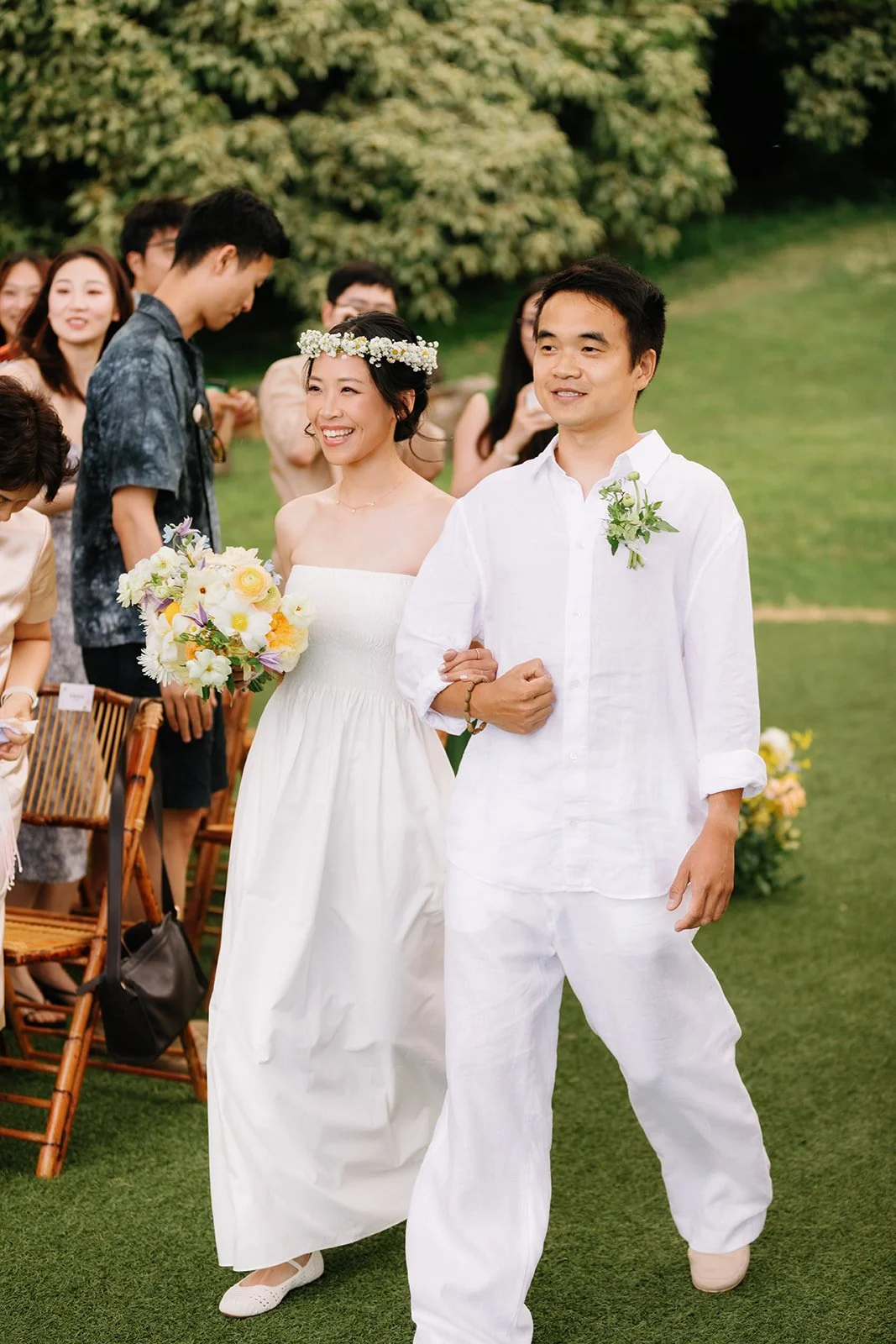 Bride and groom walking down ceremony aisle