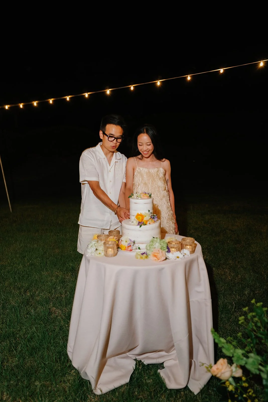 Bride and groom cut their cake