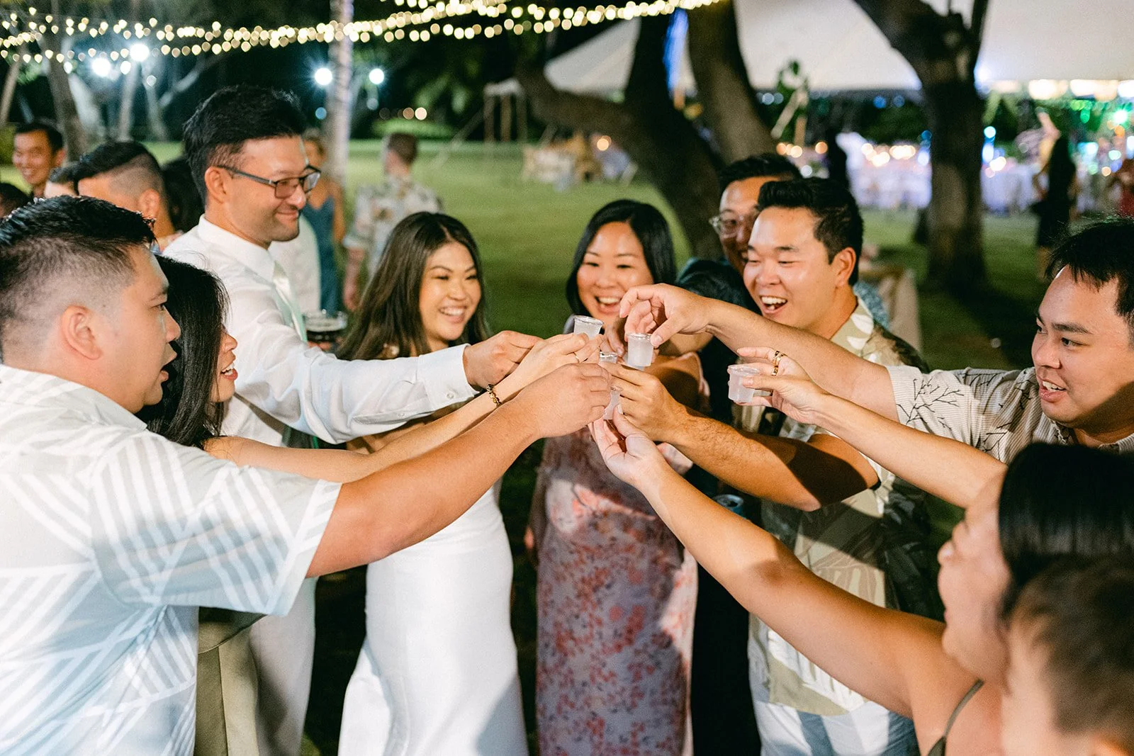 bride and groom taking shots with guests