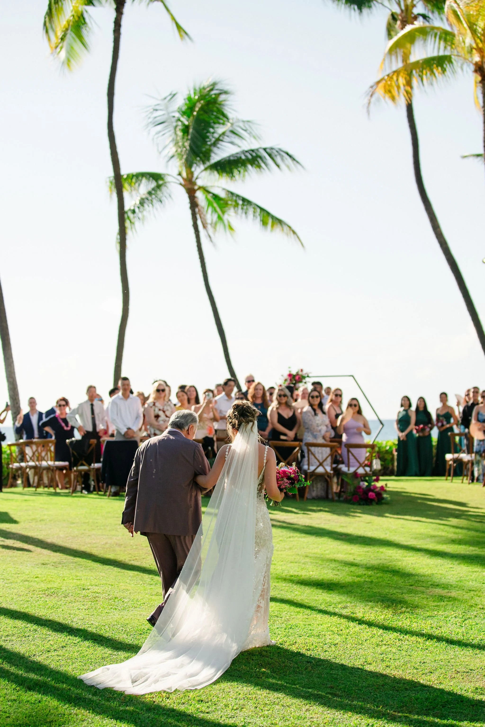 bride and father walking down the aisle in hawaii