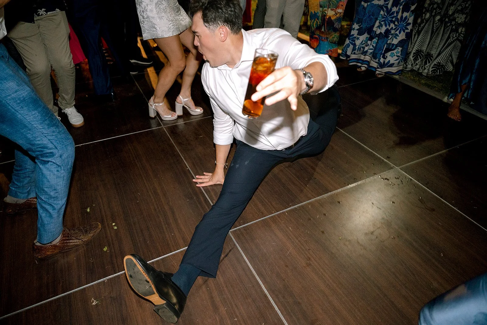 wedding guest doing splits on the dance floor