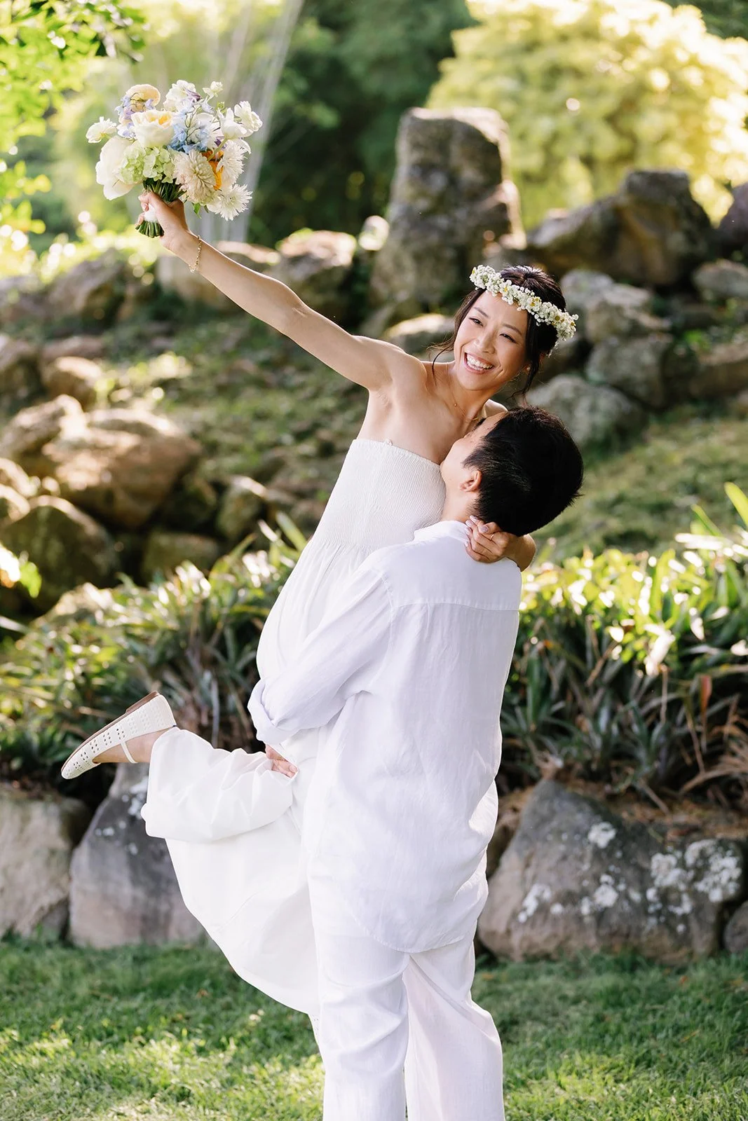 Groom picks up bride