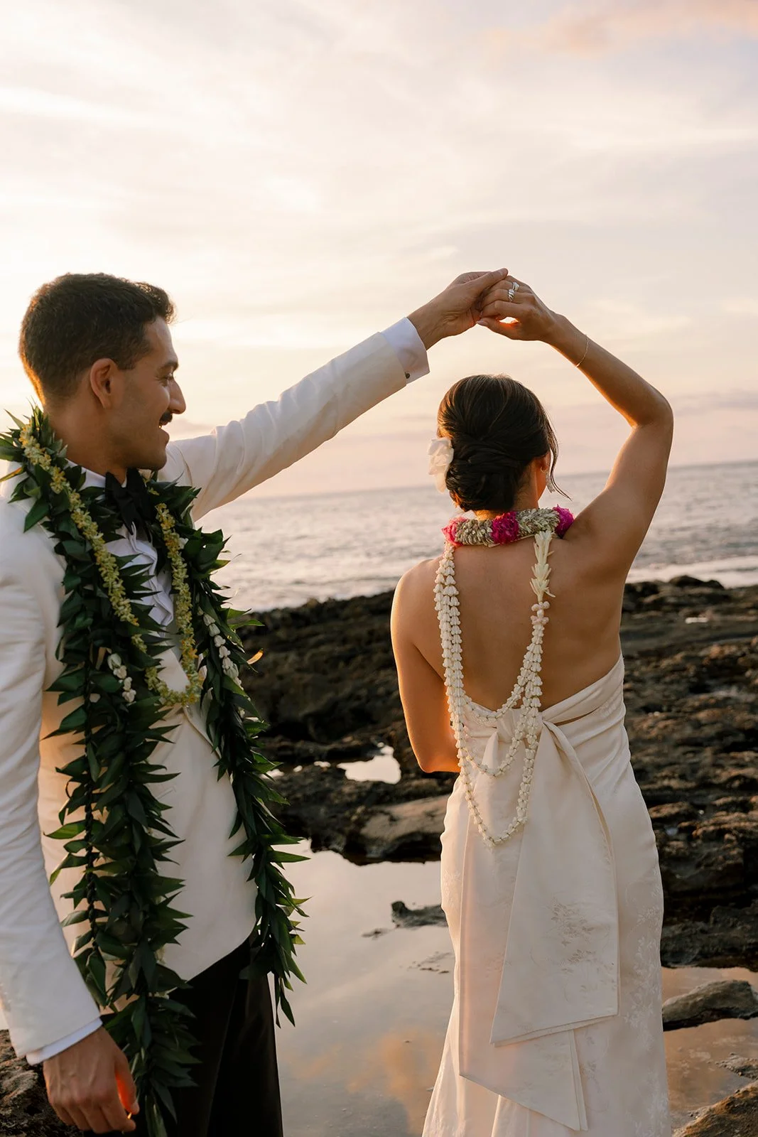 bride and groom dancing on the beach