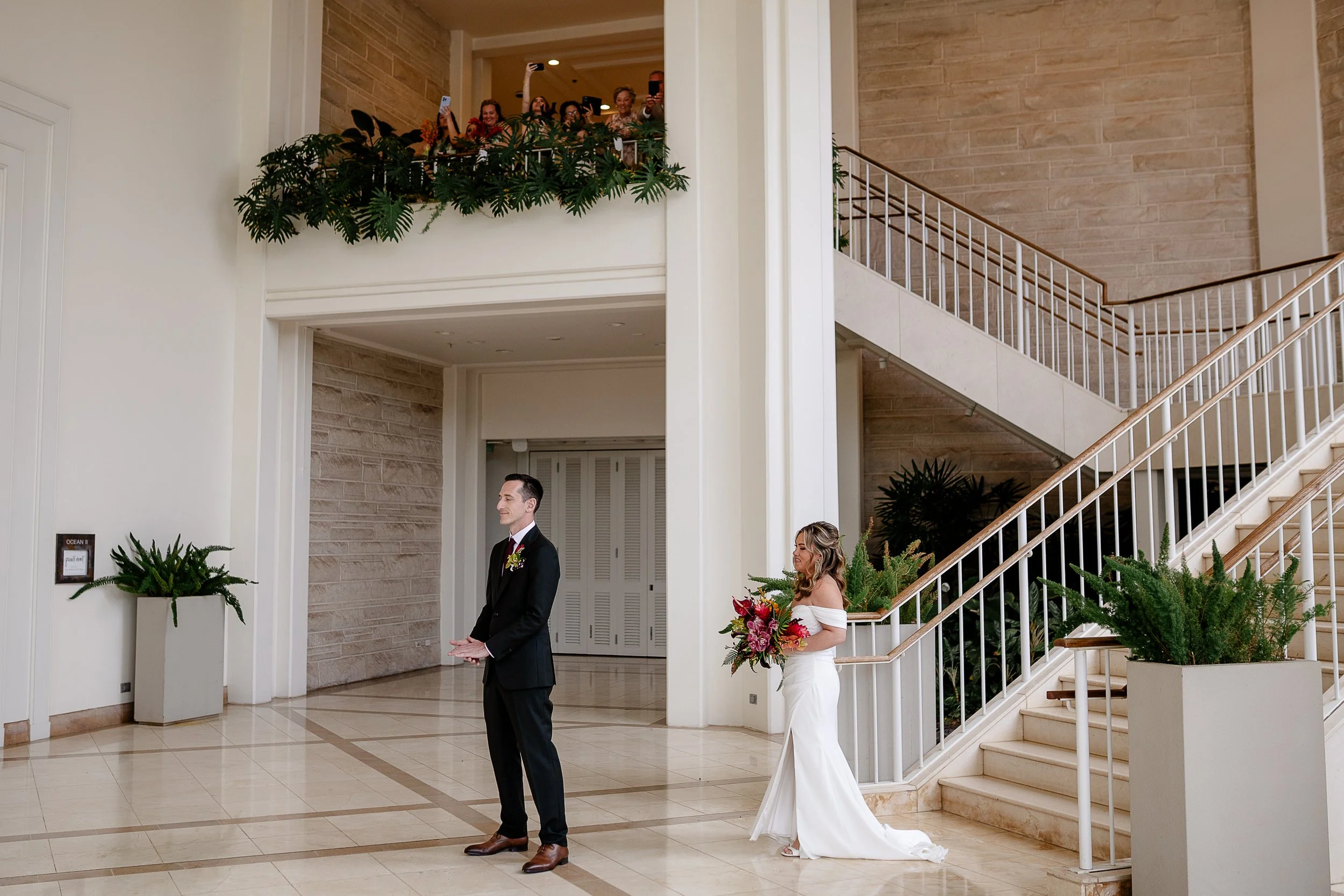 bride and groom first looks with tropical bouquet in Hawai'i