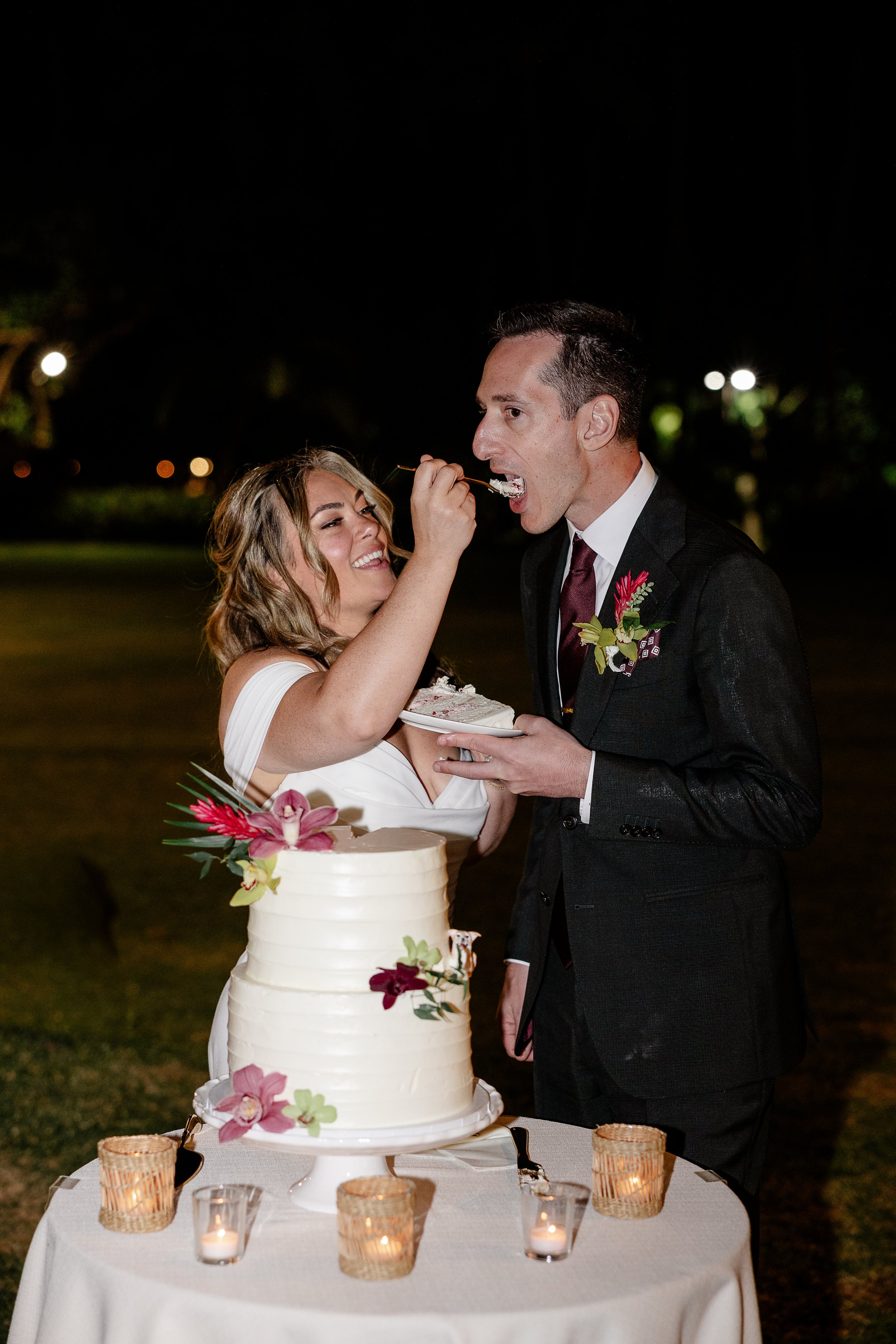 bride and groom eating cake