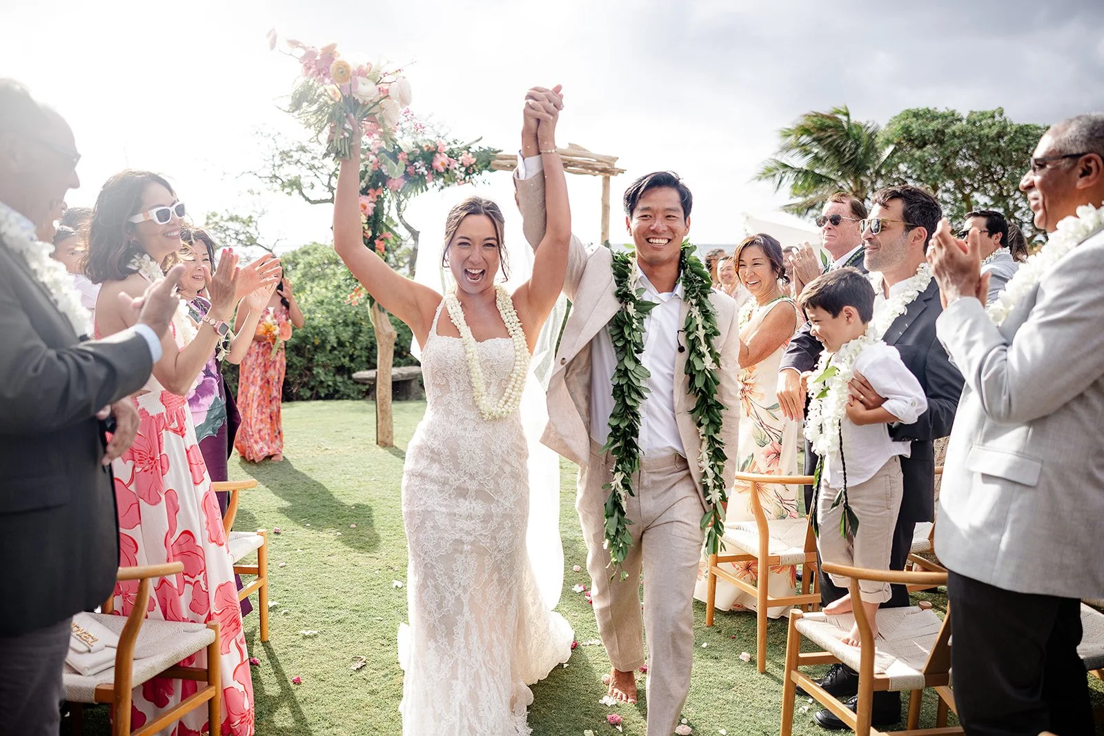 bride and groom walking down the aisle in hawaii